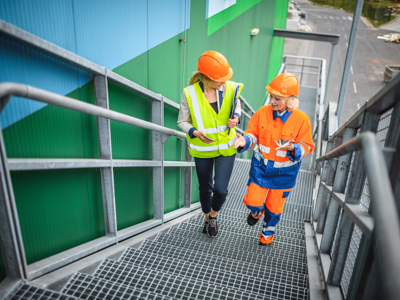 Recycling Workers Walking Up Steps